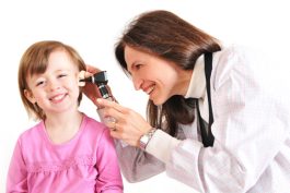 A doctor checking for an ear infection